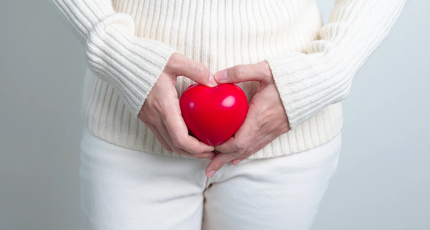 woman holding heart in hands